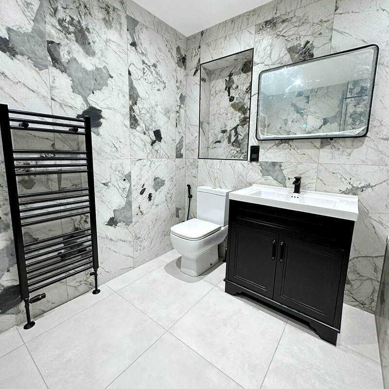 Vanity basin with black accessories in a St Albans bathroom