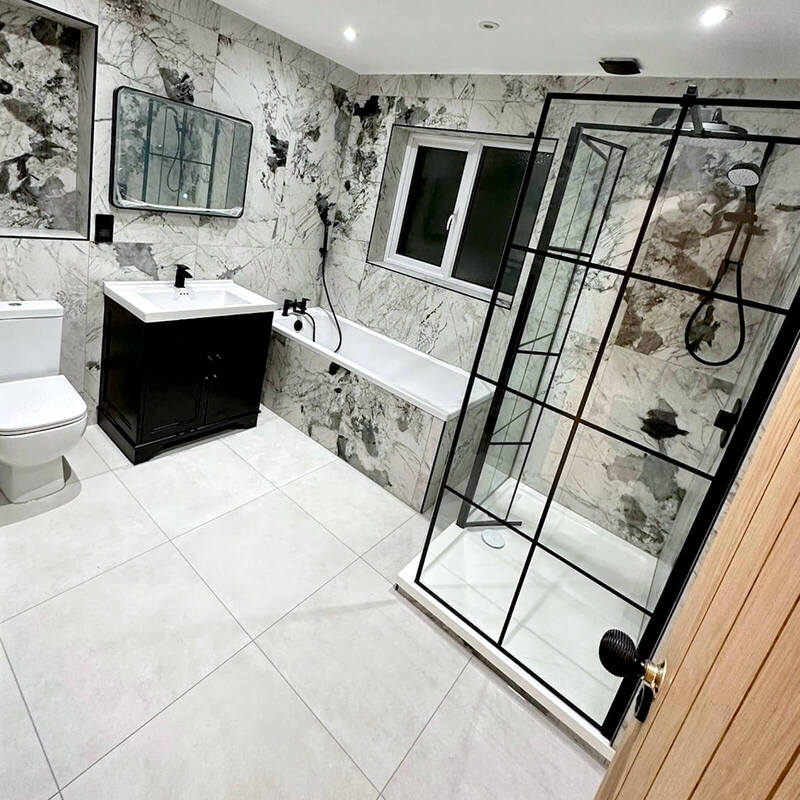  Luxurious tiled bathroom with walk-in glass shower by St Albans Bathroom Fitters