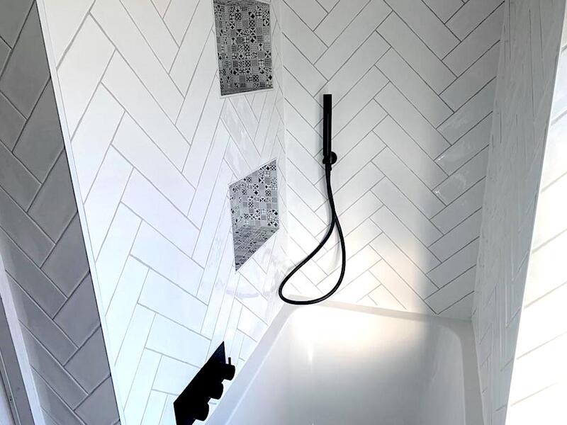 Stunning herringbone tiling design for your bath and shower for a seamless and sophisticated finish.