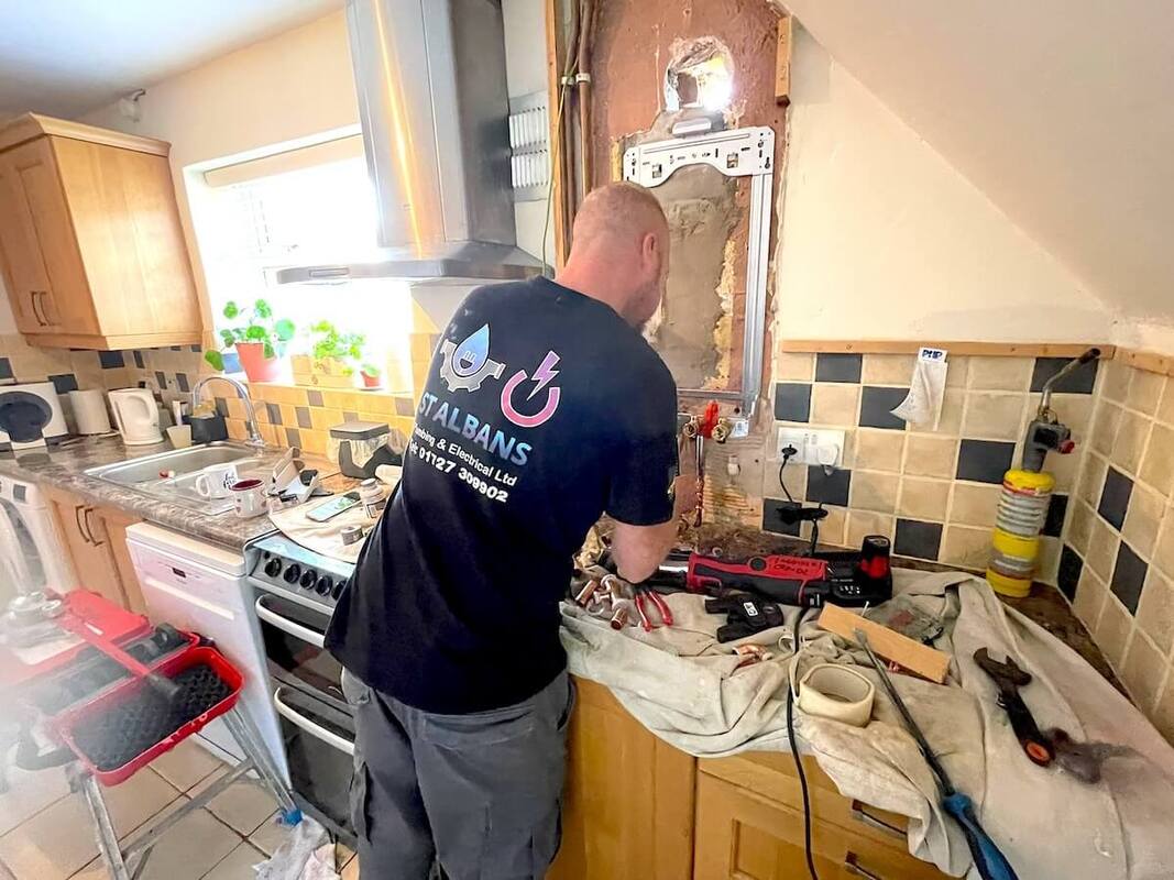 Gas Safe Engineer Installing Boiler in St Albans